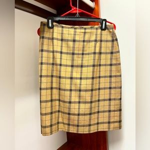 Smart a-line plaid skirt. Looks fantastic with boots and flats.